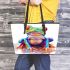 Cute colorful frog sitting on water leaather tote bag