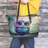 Cute colorful owl cartoon with big eyes sitting on a tree branch leather tote bag