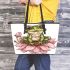 Cute frog sitting on the flower leaather tote bag