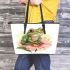 Cute frog sitting on the flower leaather tote bag