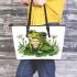 Cute frog sitting on the grass with flowers leaather tote bag