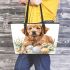 Cute golden retriever with easter eggs and white daisies leather tote bag