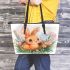 Cute happy baby bunny with big eyes sitting leather tote bag