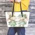 Cute happy smiling bunny girl and boy in green leather tote bag