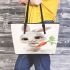 Cute happy white rabbit with big eyes holding one carrot leather tote bag