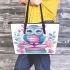 Cute owl sitting on books in pink and blue colors with flowers leather tote bag