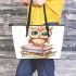 Cute owl sitting on top of books leather tote bag