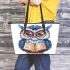 Cute owl teacher with a book and glasses leather tote bag