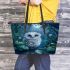 Cute owl with big blue eyes perched leather tote bag