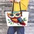 Cute owl with big eyes colorful feathers and beautiful wings perched leather tote bag