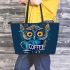 Cute owl with big yellow eyes holding a coffee cup leather tote bag