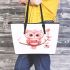 Cute pink owl holding a heart on a branch leather tote bag