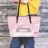 Cute pink owl sitting on top of the car leather tote bag