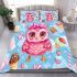 Cute pink owl with a bow on its head surrounded by candy bedding set