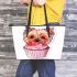 Cute pink yorkshire terrier in a cupcake leather tote bag