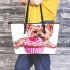 Cute pink yorkshire terrier in a cupcake leather tote bag