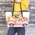 Cute pomeranian dog in a pink truck with flowers leather tote bag