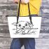 Cute puppy playing with a stick coloring page for kids leather tote bag