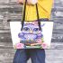 Cute purple owl sitting on top of books with pink roses leather tote bag