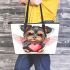 Cute valentine yorkie with angel wings holding a heart leather tote bag