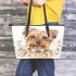 Cute yellow long haired smiling yorkshire terrier leather tote bag