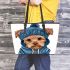 Cute yorkshire terrier in hoodie leather tote bag