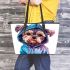 Cute yorkshire terrier in hoodie leather tote bag