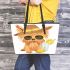 Cute yorkshire terrier wearing summer leather tote bag