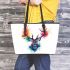 Deer head with colorful watercolor splash behind leather totee bag