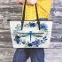 Dragonfly with flowers and leaves leather tote bag