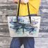 Dragonfly with swirling lines and swirls leather tote bag