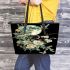 Flowers and dragonflies around the moon leather tote bag