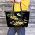 Flowers and dragonflies around the moon leather tote bag