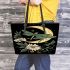 Green dragonflies flying around the moon leather tote bag