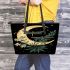 Green dragonflies flying around the moon leather tote bag