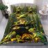 Green tree frog sits on top of a black pot with gold coins bedding set