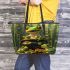 Green tree frog sits on top of a black pot with gold coins leaather tote bag