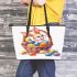 Happy easter bunny with colorful eggs in a basket isolated leather tote bag