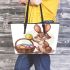 Happy easter bunny with colorful eggs in a basket isolated leather tote bag