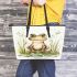 Happy frog sitting in the grass near a pond leaather tote bag