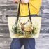 Majestic deer with impressive antlers standing in the forest leather totee bag