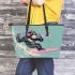 Monkey wearing sunglasses surfing with trumpet leather tote bag