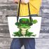 Ominous frog with clover in his hat leaather tote bag