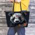 Panda with black and white fur and colorful floral leather tote bag