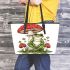 Red and white mushroom with green frog sitting on it leaather tote bag