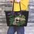 Skull with green frog on top and purple thistle flowers growing leaather tote bag