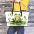 Smiling frog sitting on a pond leaather tote bag