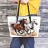 Three horses are galloping in the wind leather tote bag