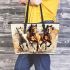 Three horses are galloping in the wind leather tote bag