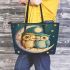 Two cute owls in love hugging each other on the moon leather tote bag